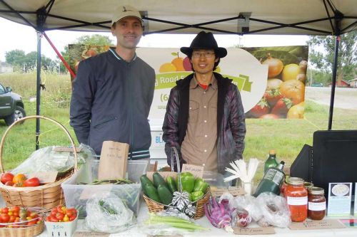 owners of Long Road Ecological Farm, Jonathan Davies and Xiaoeng Shen at the Friday Frontenac Farmers Market in Harrowsmith on August 15